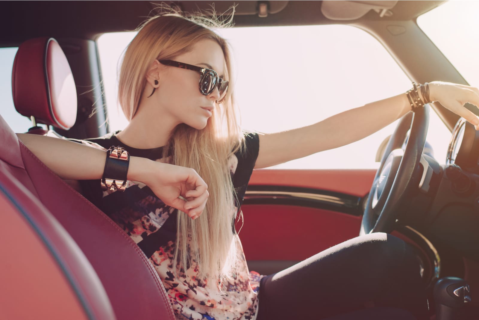 beautiful blond woman sitting in the car