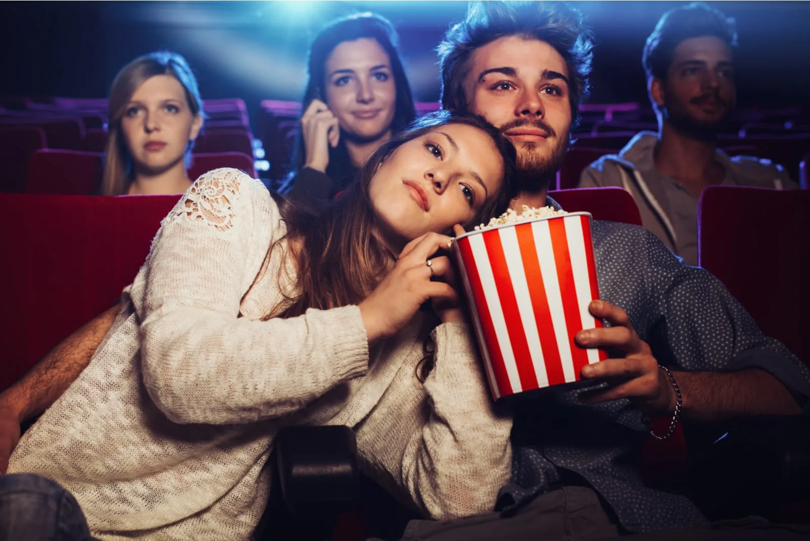 couple sitting, watching movie