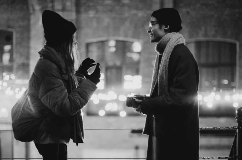 couple talking outside on winter
