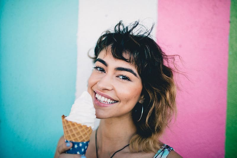 happy woman posing with ice cream