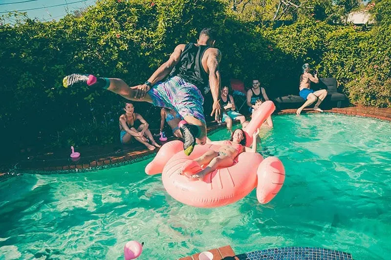 man jumping in pool
