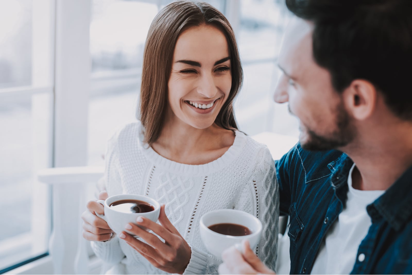 man making woman laugh