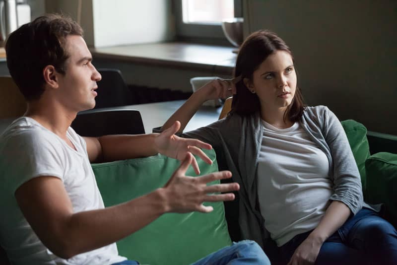 man talking to woman