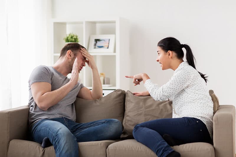 Man trying to defend from arguing by her woman