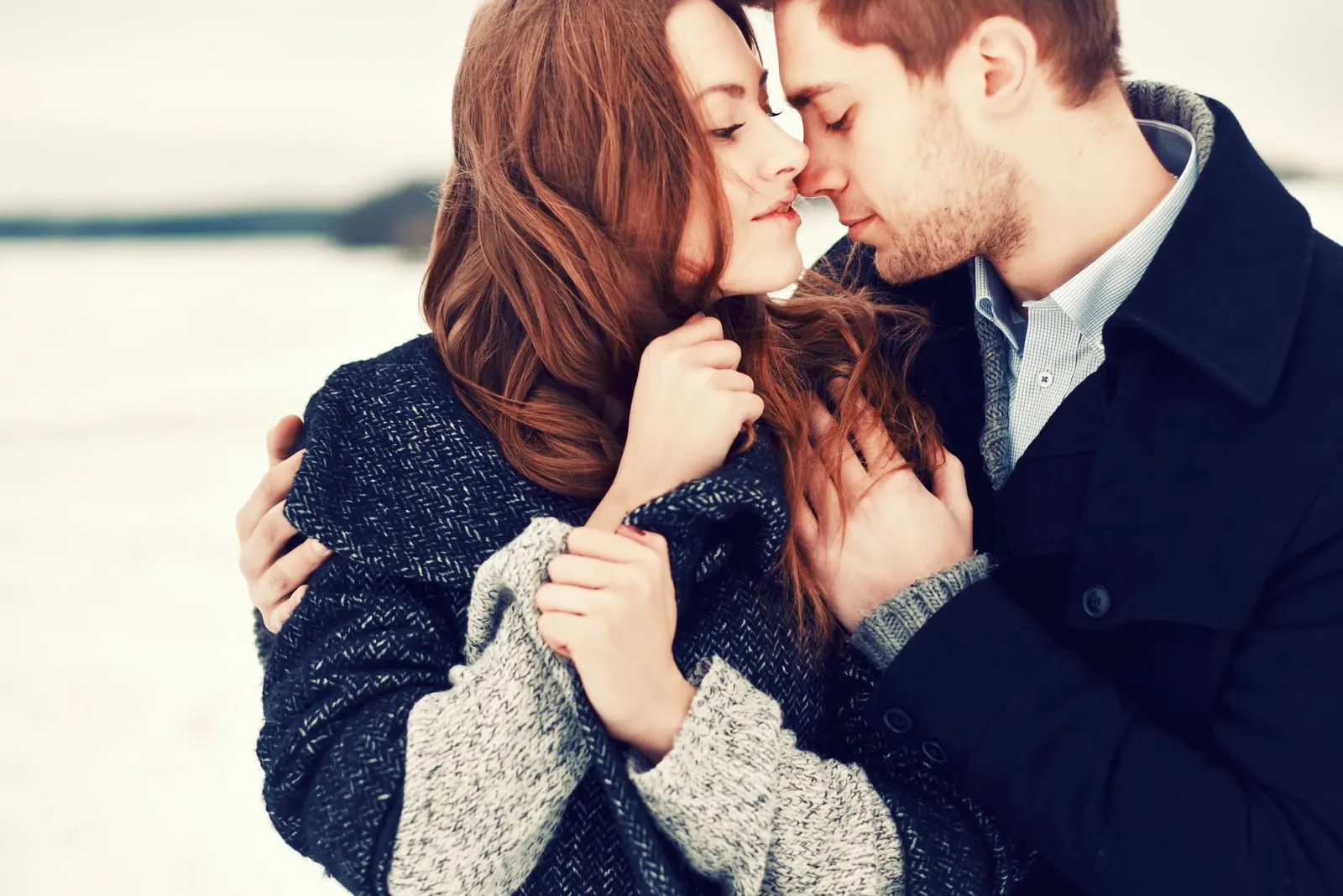 portrait of young sensual couple in cold winter weather
