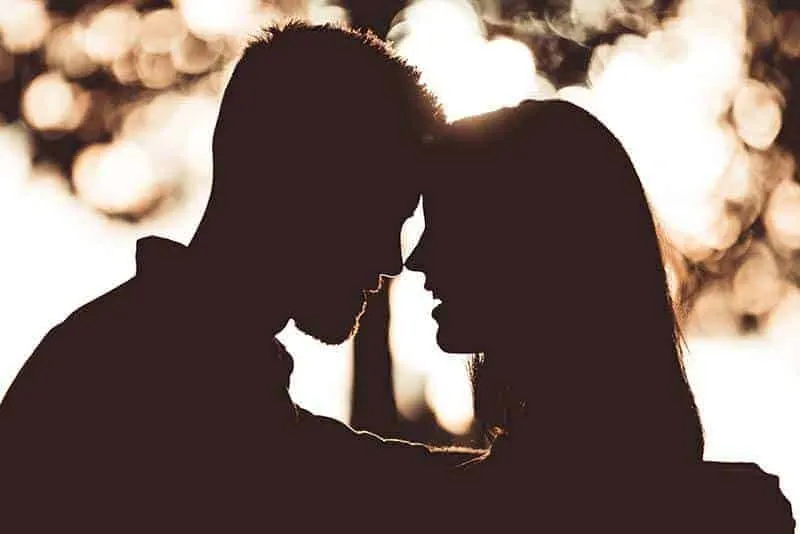 silhouette of couple standing close each other