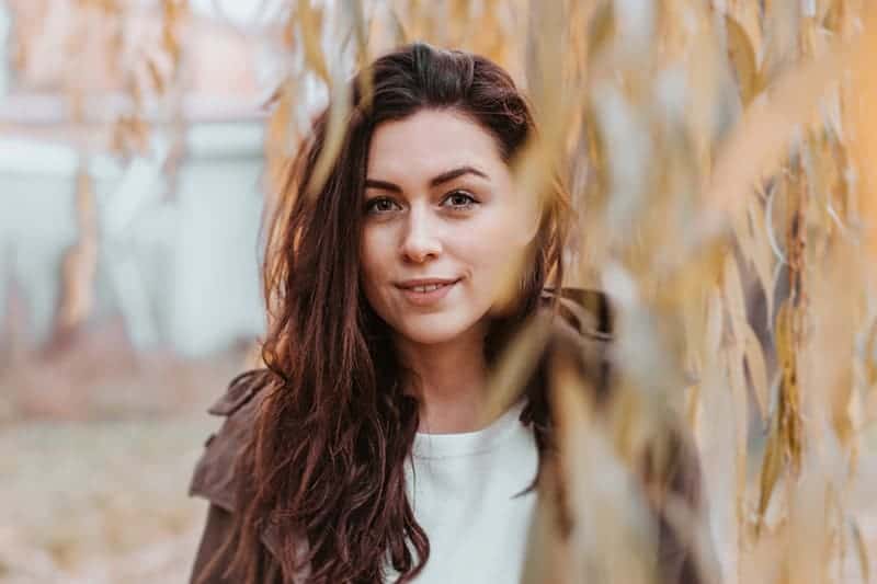 woman in brown coat standing outside