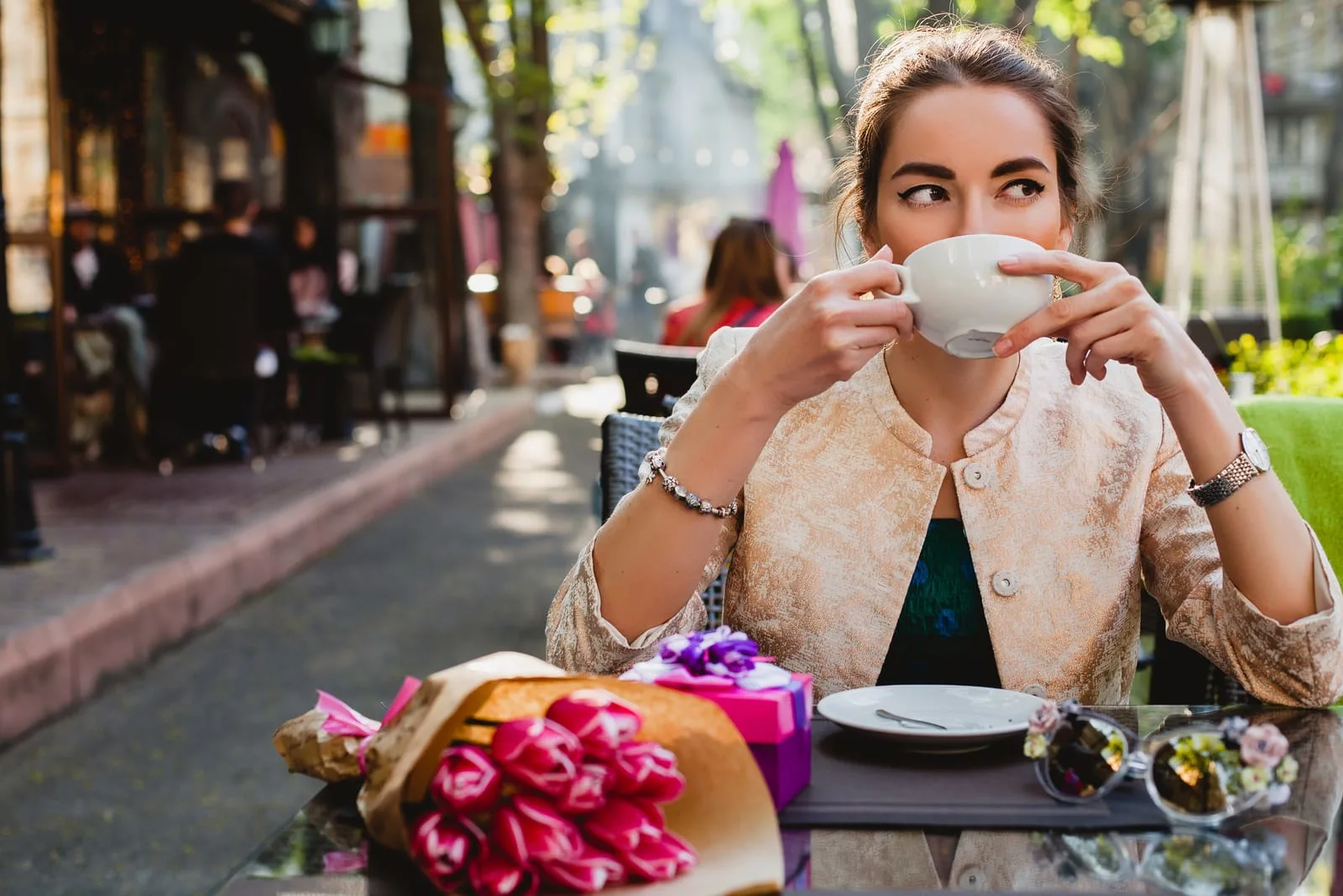 woman sitting drinking coffee