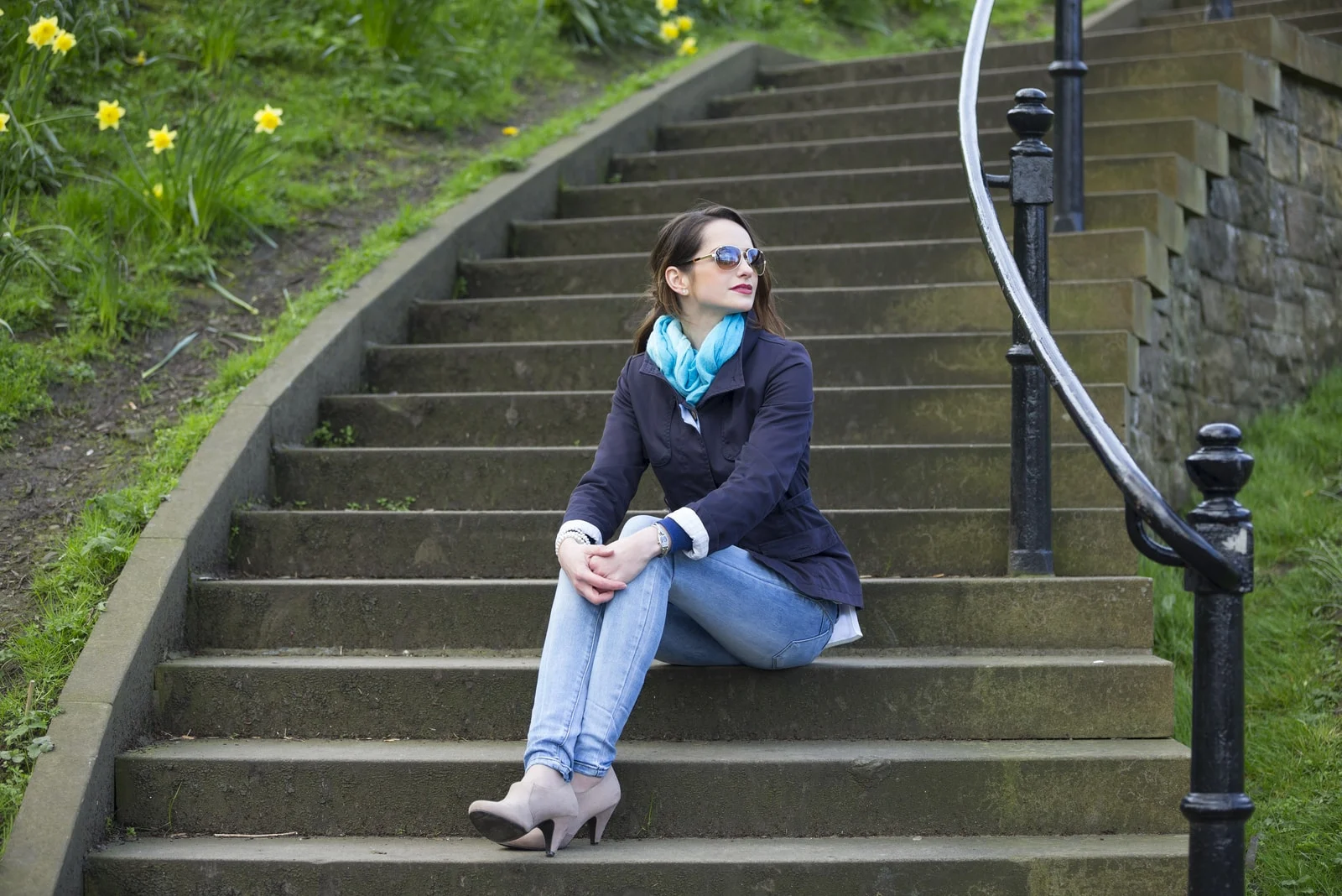 woman wearing sunglasses sitting on stairs