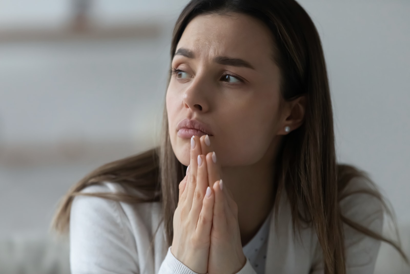 worried brunette looking at distance