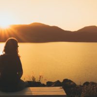 sad woman sitting alone outdoor