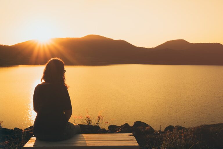 sad woman sitting alone outdoor