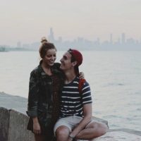 smiling couple hugging by the sea