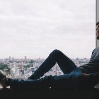 man sitting by the window