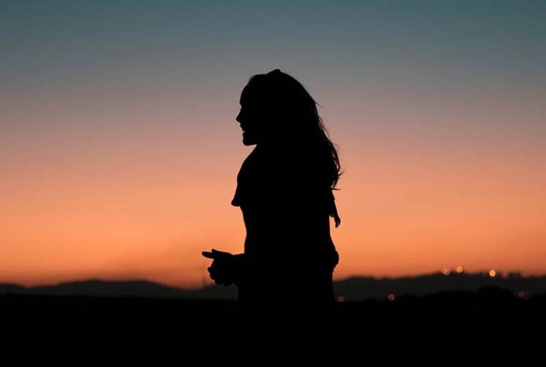 silhouette of woman standing outside