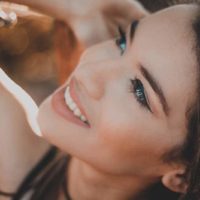 close up photo of beautiful smiling woman