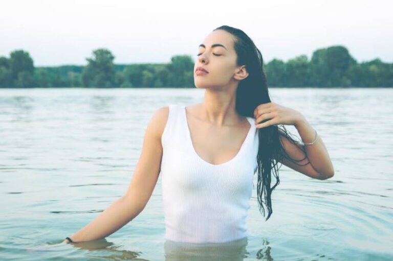 woman in long bikini standing in the water