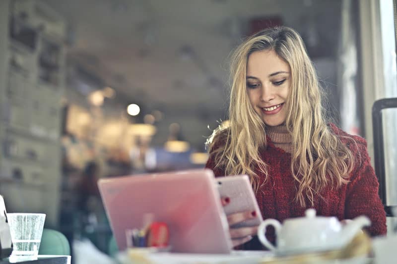 beautiful woman typing on phone