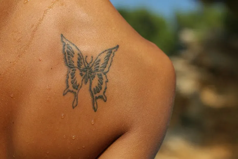butterfly tattoo on womans back