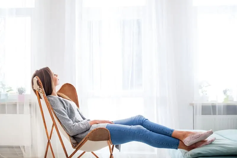 calm woman relaxing in the bedroom