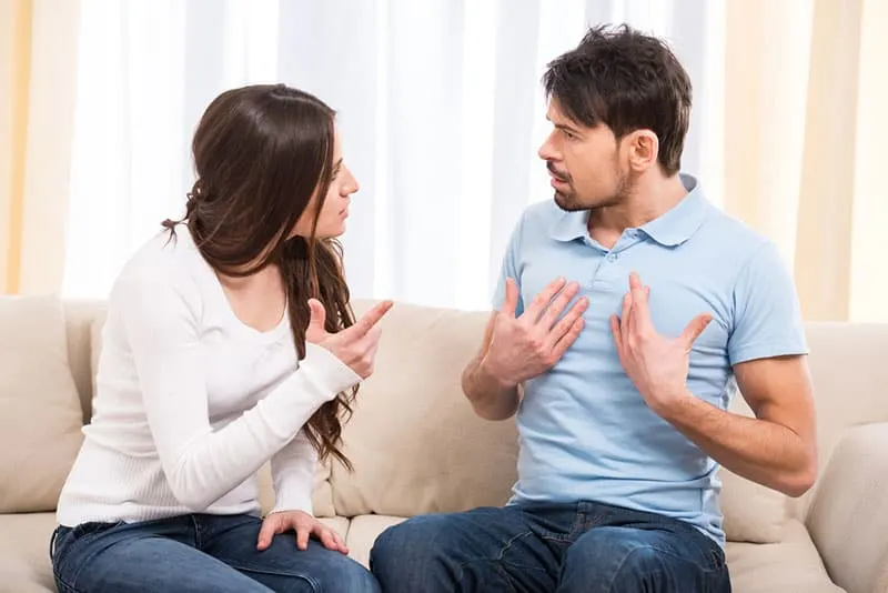 couple arguing in living room
