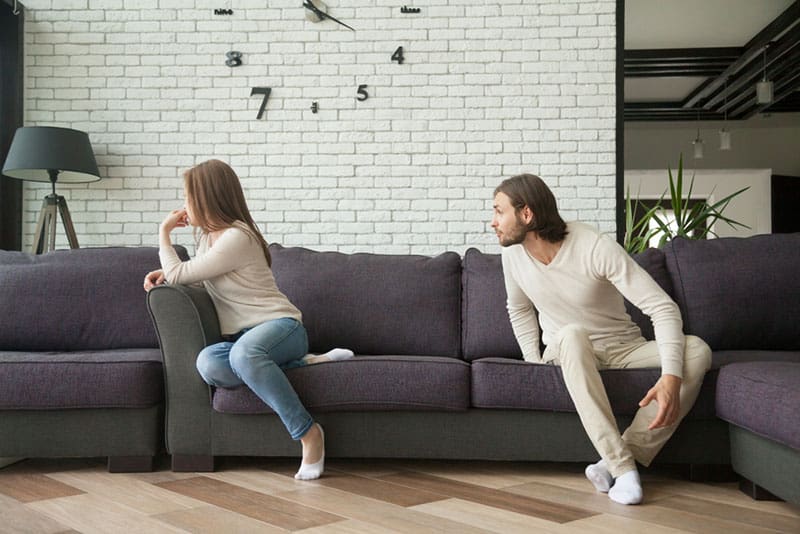 couple arguing on the couch
