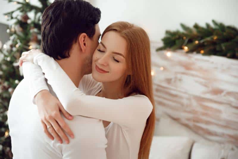couple hugging in living room