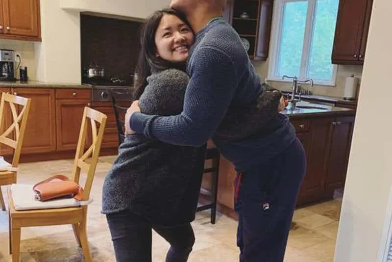 couple hugging in the kitchen