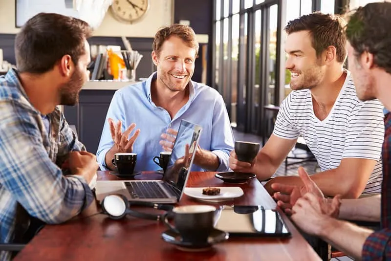 group of men talking and having coffee break