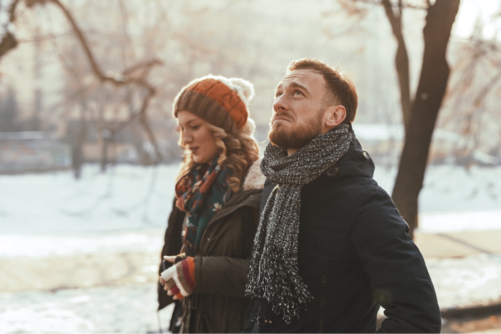 serious couple walking in the park