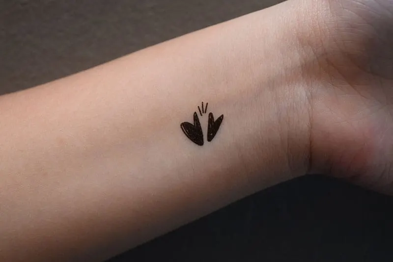 two little heart tattoo on the wrist