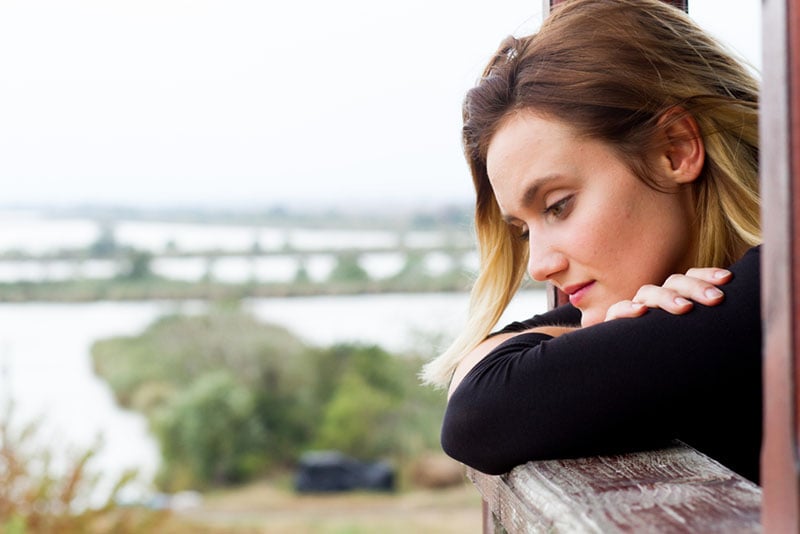 worried young woman looking at distance