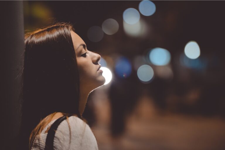 thoughtful woman during night