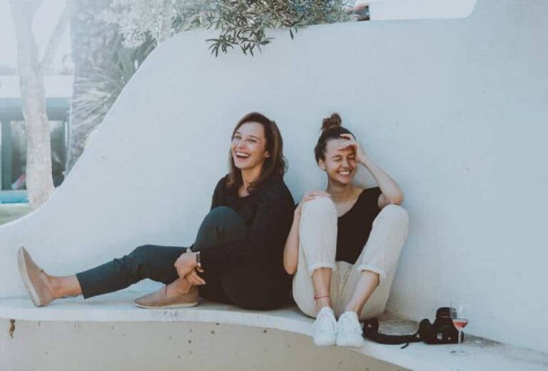 two smiling female friends