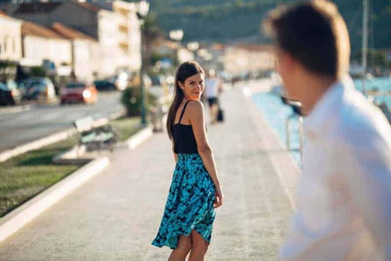 ma and woman looking each other on street