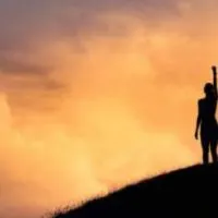a woman standing on a mountain