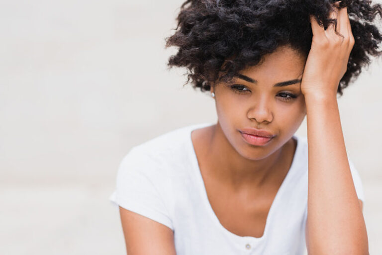 worried woman looking at one point