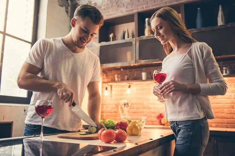 couple cooking together in the kitchen