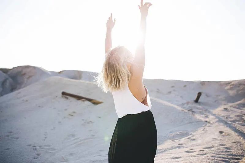 happy girl raising her hands up