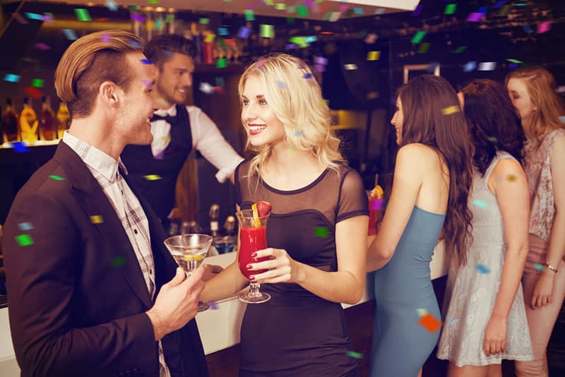 man flirting with woman in the bar