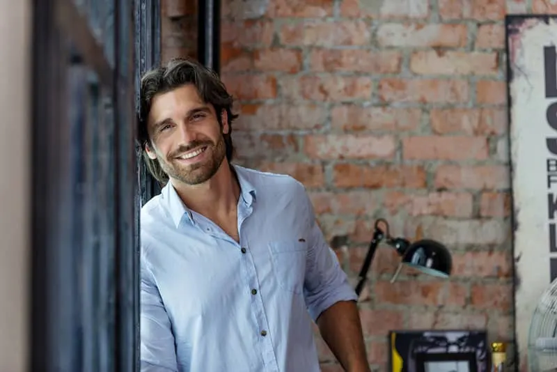 smiling man in shirt posing