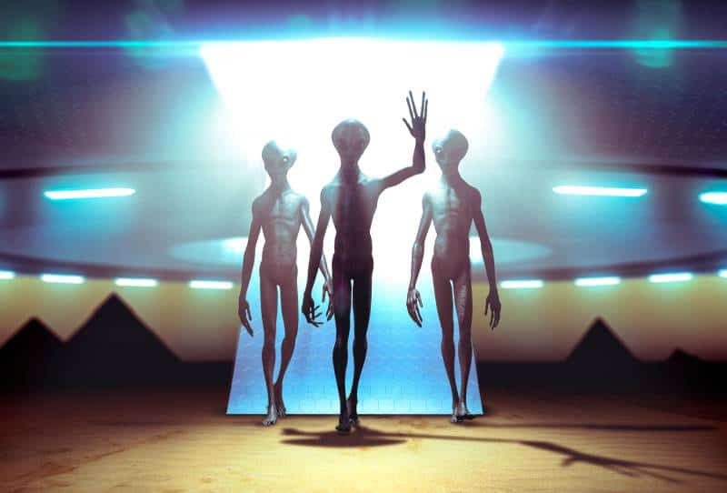 three aliens landing with ufo on earth