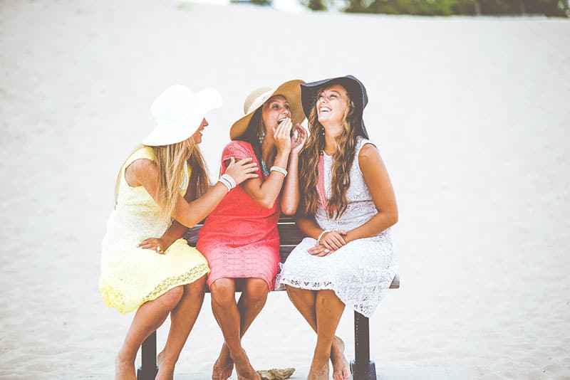 three friends talking and laughing