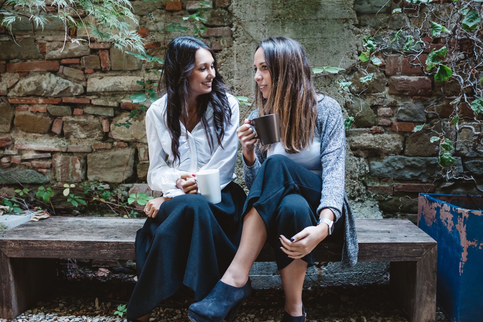 two friends sitting and drinking coffee