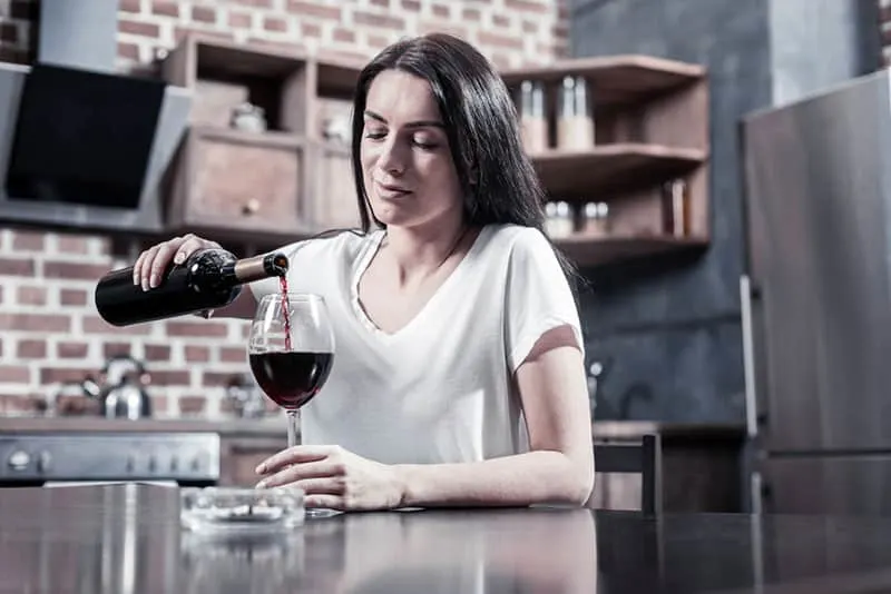 woman drinking a red wine