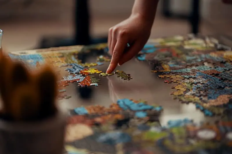 woman playing with puzzles