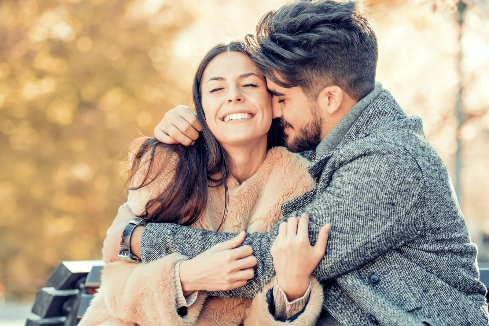 young couple hugging and laughing 