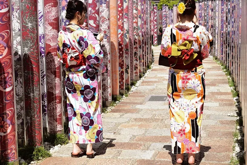 young stylish asian woman wearing detailed dresses