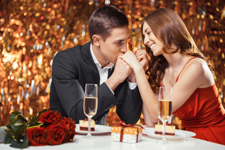 a smiling couple at a romantic dinner