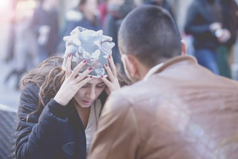 man talking to worried woman